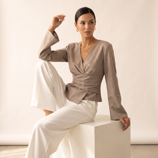 Norell top met gedrapeerde taille