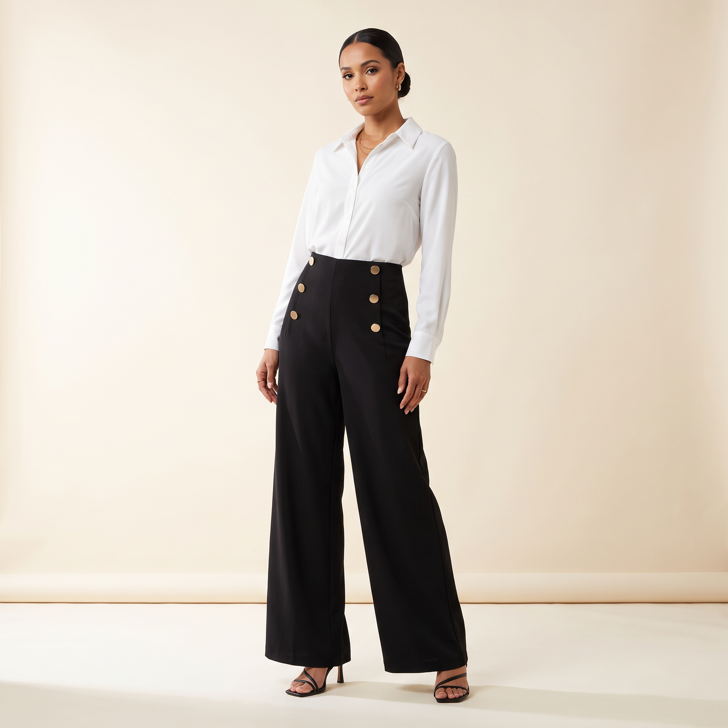 Vela-broek met drie knopen en wijde pijpen
