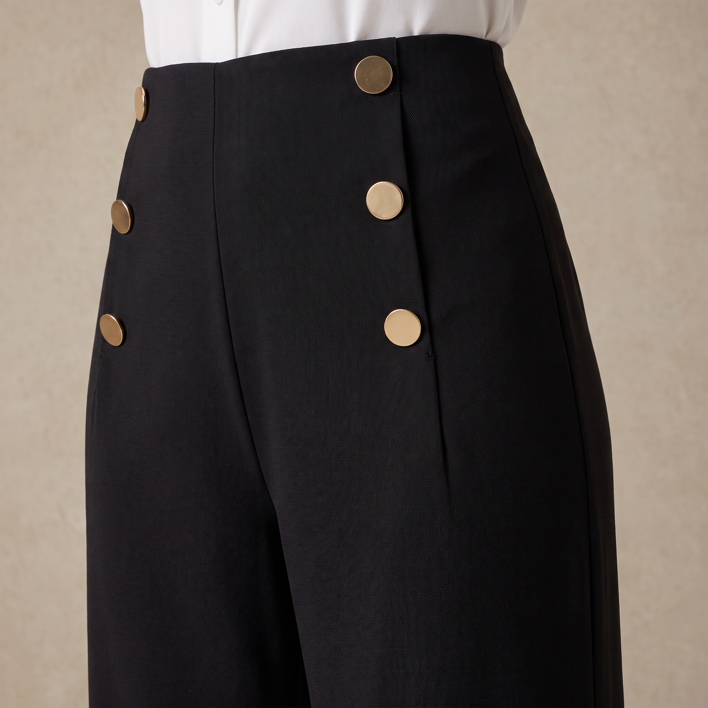 Vela-broek met drie knopen en wijde pijpen